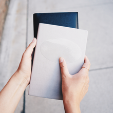 Load image into Gallery viewer, Oval_Sticker_Clear_ClearOvalSticker_Notebook_H_Mockup.png_15757586