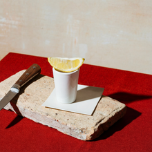 Load image into Gallery viewer, Ceramic_Shot_Glass_-_White_White_Lifestyle_01_Lemon_Wedge_Mockup.png_15746323
